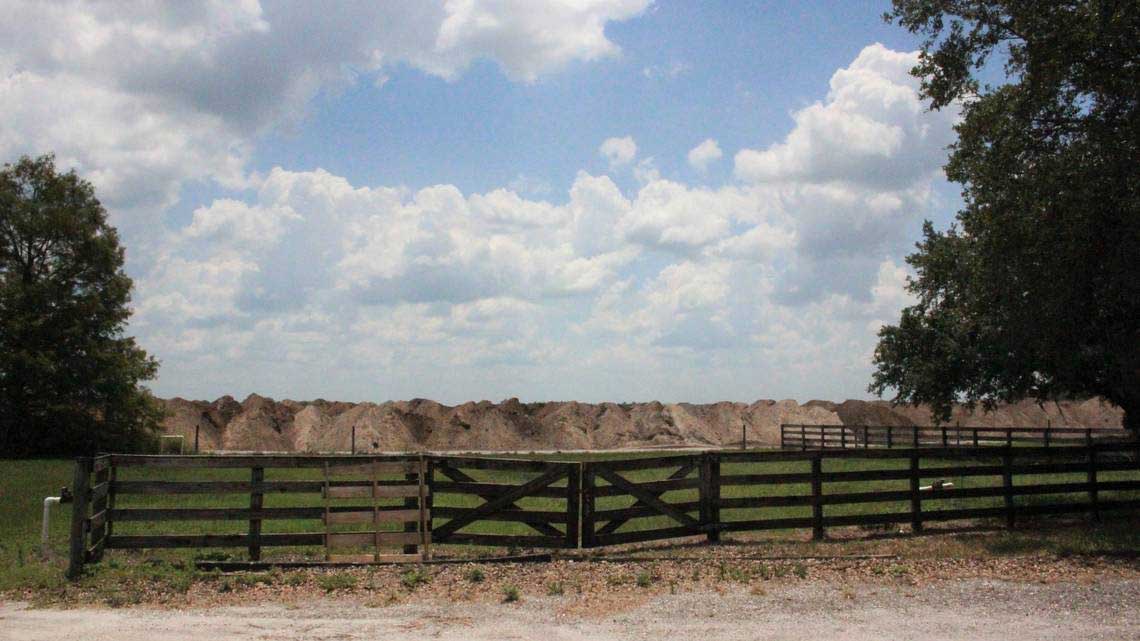 Earth is heaped behind the fence on the SMR Farms building, part of Lakewood Ranch’s Northeast Quadrant
