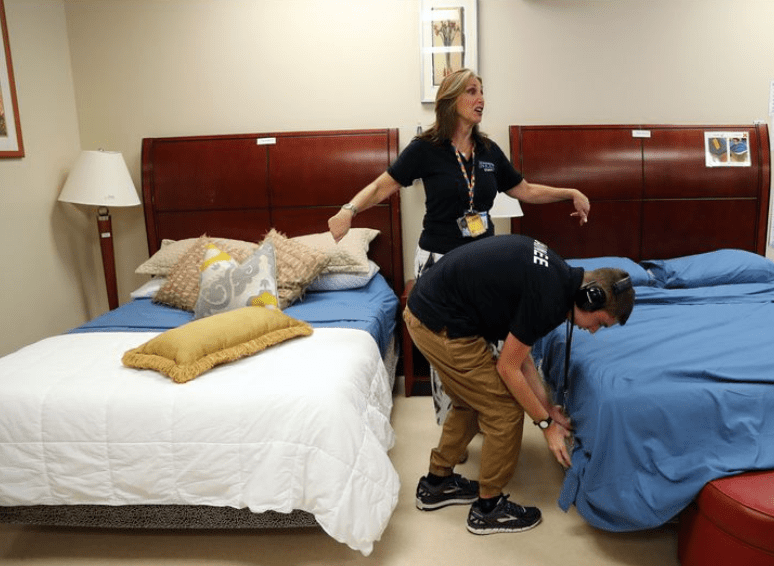 A Project Next trainee works on making beds at the Palm Beach School for Autism in Lake Worth on Wednesday, Sept. 18, 2019. The school unveiled a new 10,000-square-foot kitchen extension, classroom, mock hotel room and more for culinary and hospitality students with autism.