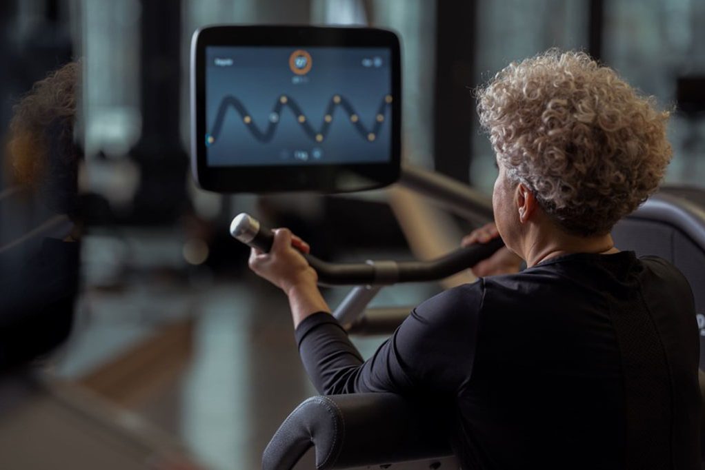 older lady on indoor bike