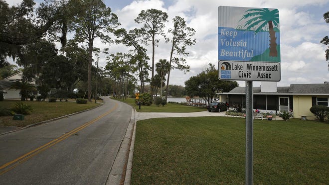 road with sign saying keep winnemissett beautiful