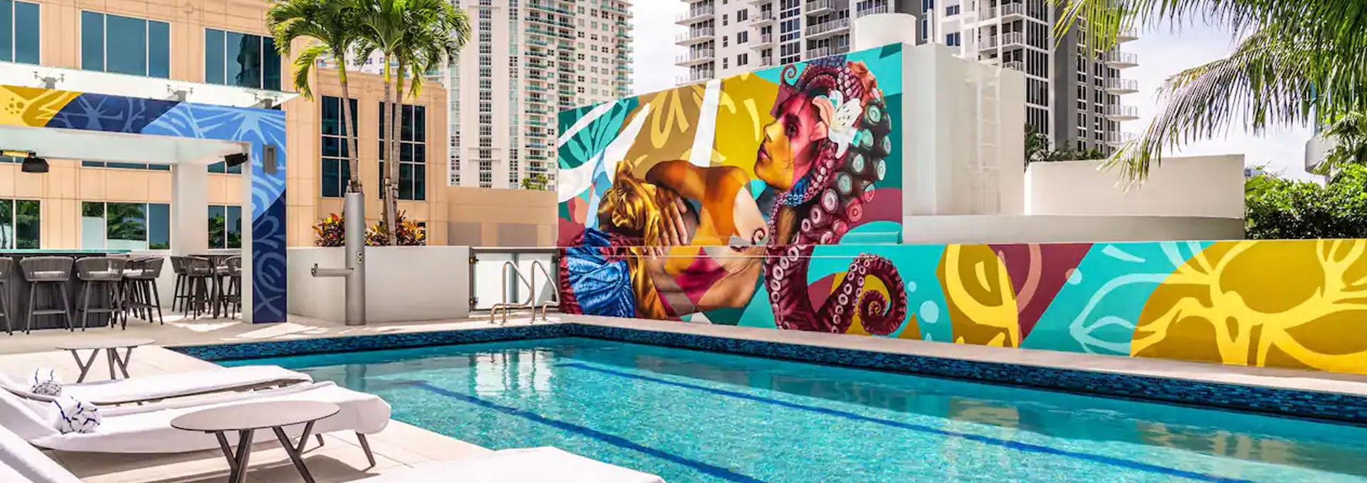 pool deck with painted mural on wall