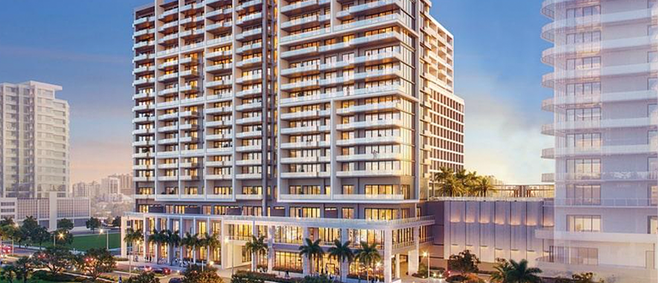 Rendering of a modern luxury condominium tower along a landscaped city boulevard