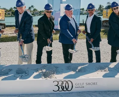 People with shovels at construction groundbreaking ceremony