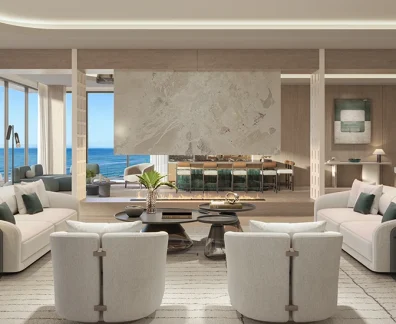 Contemporary oceanfront great room with curved sofas, fireplace, bar, and floor-to-ceiling windows.